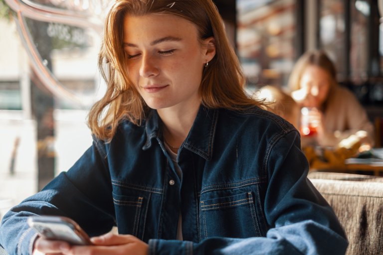 Picture of a girl looking at her mobile